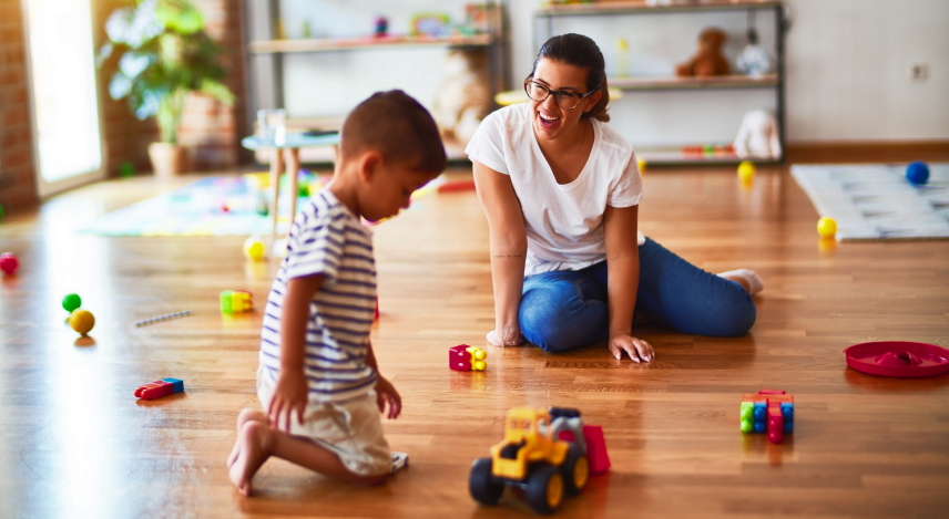 children picking up toys